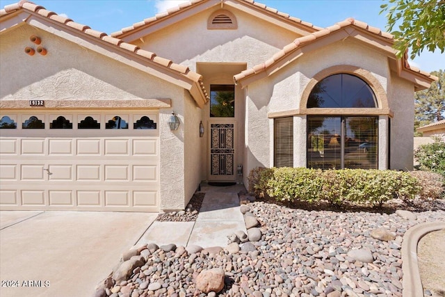 view of front of property with a garage