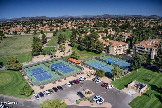 birds eye view of property with a mountain view