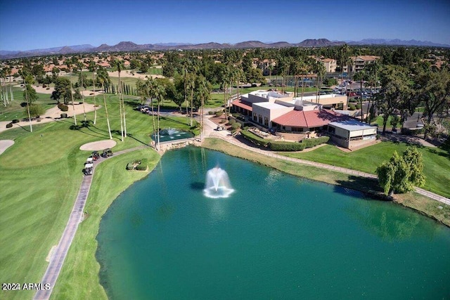 birds eye view of property with a water and mountain view