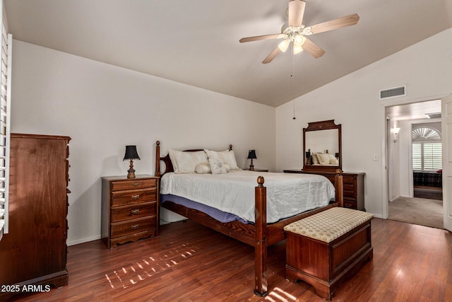 bedroom with vaulted ceiling, dark wood-style flooring, and ceiling fan