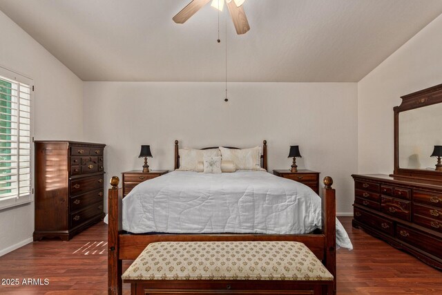 bedroom with wood finished floors, multiple windows, baseboards, and ceiling fan