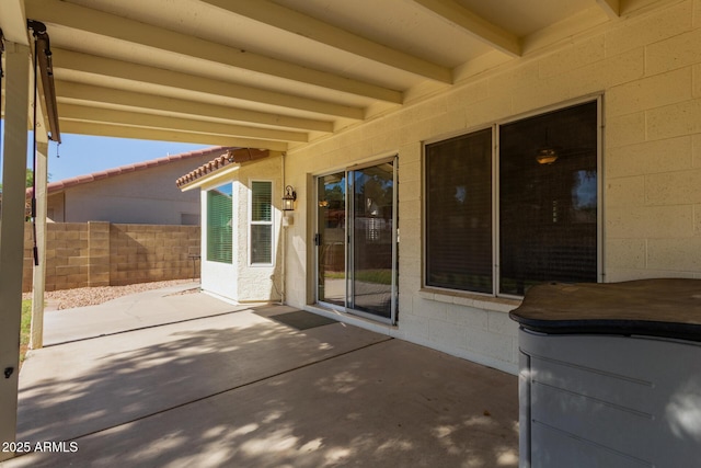 view of patio featuring fence