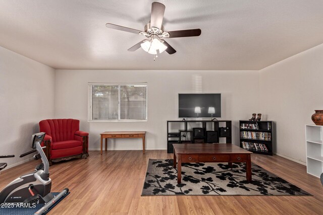 home office with ceiling fan, wood finished floors, and baseboards
