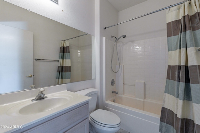 full bathroom with shower / bath combination with curtain, vanity, and toilet