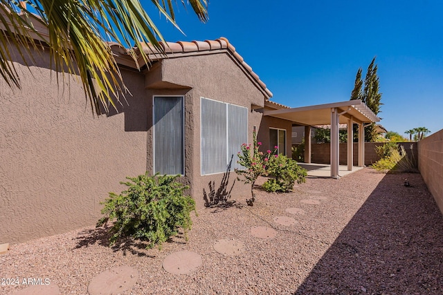 view of home's exterior with a patio