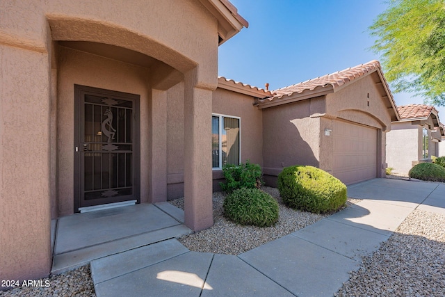 property entrance with a garage