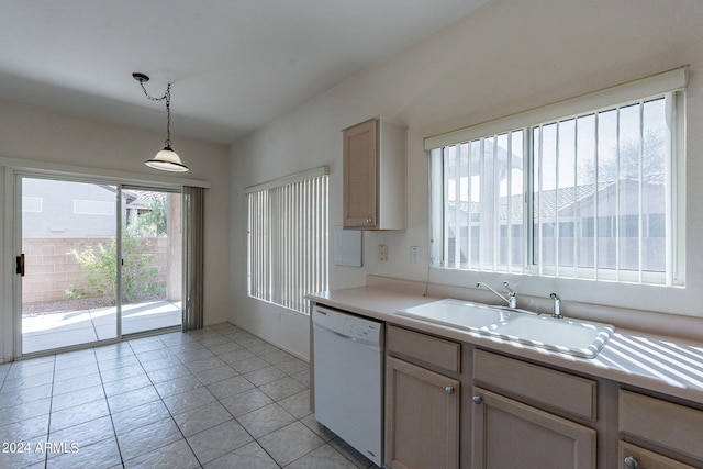 kitchen with pendant lighting, sink, light tile patterned floors, dishwasher, and light brown cabinetry