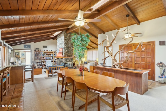 dining area with ceiling fan, beamed ceiling, high vaulted ceiling, light carpet, and wood ceiling