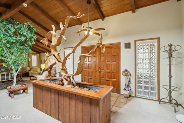 carpeted home office featuring beam ceiling, high vaulted ceiling, ceiling fan, and wooden ceiling