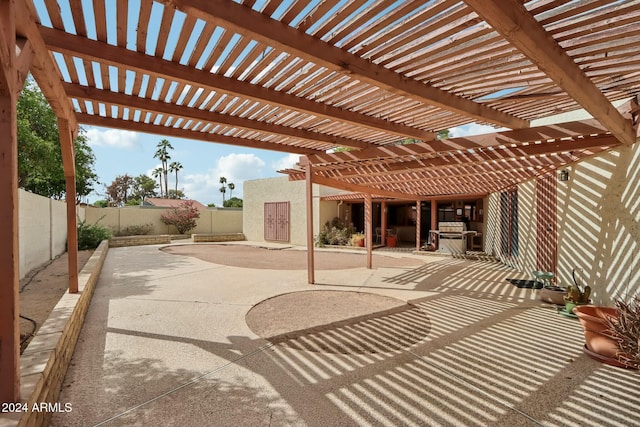 view of patio / terrace featuring a pergola and exterior kitchen