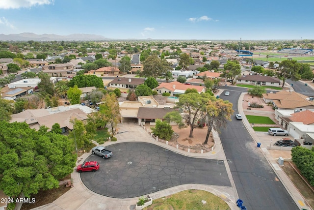 birds eye view of property with a mountain view