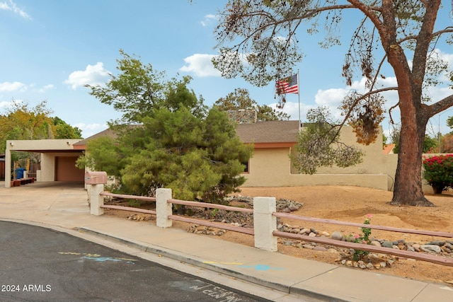 view of front of property featuring a carport