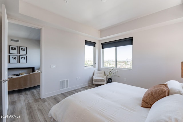 bedroom with light hardwood / wood-style floors