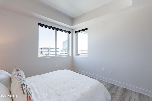 bedroom with hardwood / wood-style flooring