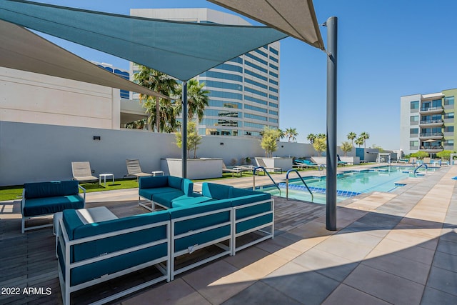 view of patio / terrace featuring outdoor lounge area and a community pool