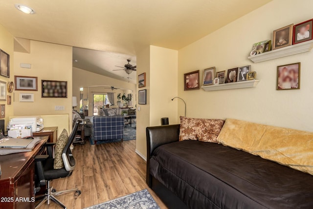 6031 N Milano Ct, Litchfield Park, AZ 85340 - living room with wood finished floors, an office area, ceiling fan, and vaulted ceiling