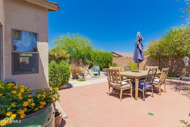 6031 N Milano Ct, Litchfield Park, AZ 85340 - view of patio / terrace with outdoor dining area and a fenced backyard