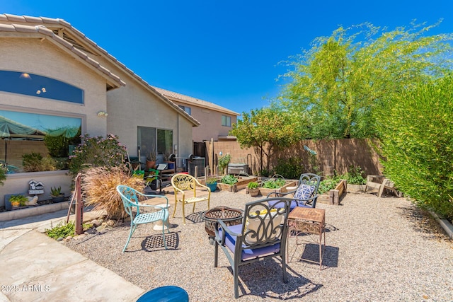 6031 N Milano Ct, Litchfield Park, AZ 85340 - view of patio / terrace featuring a fire pit and fence