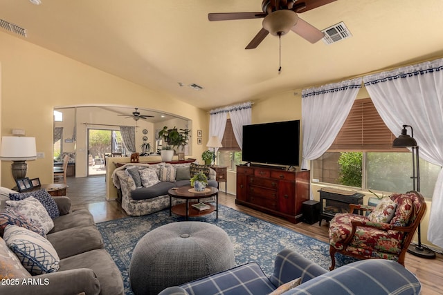 6031 N Milano Ct, Litchfield Park, AZ 85340 - living room with ceiling fan, lofted ceiling, arched walkways, and wood finished floors
