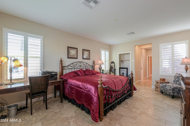 bedroom featuring multiple windows