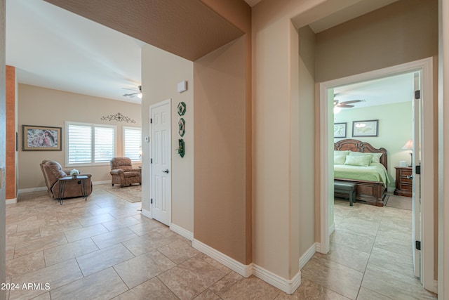 hallway with light tile patterned floors