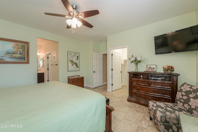 bedroom featuring connected bathroom and ceiling fan