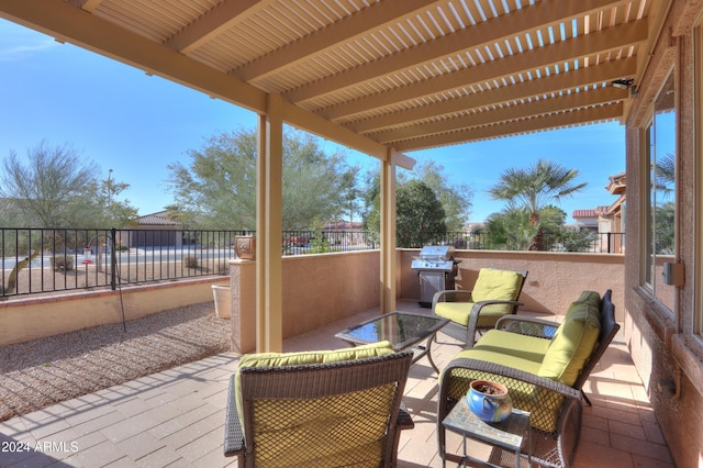 wooden deck with an outdoor living space and a patio