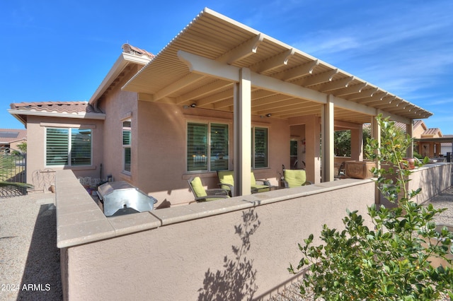 back of house featuring a patio