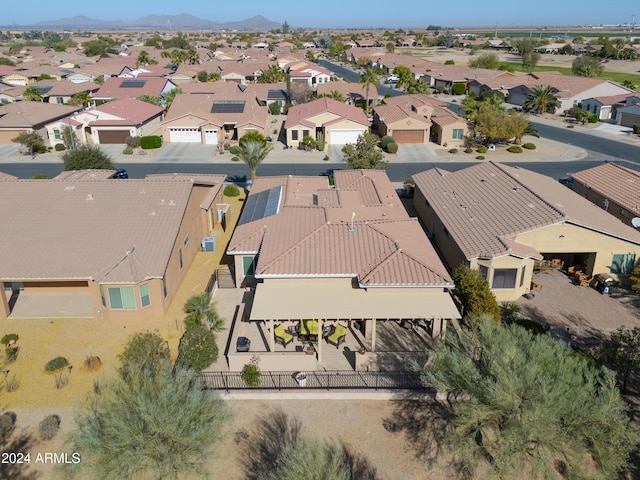 birds eye view of property with a mountain view