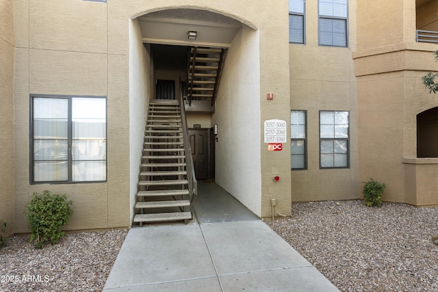 view of exterior entry with stucco siding