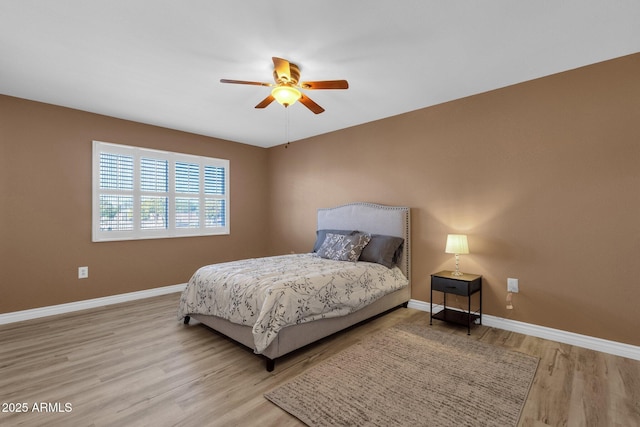 bedroom featuring ceiling fan and light wood-type flooring