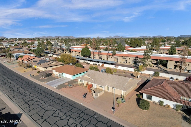 birds eye view of property with a mountain view