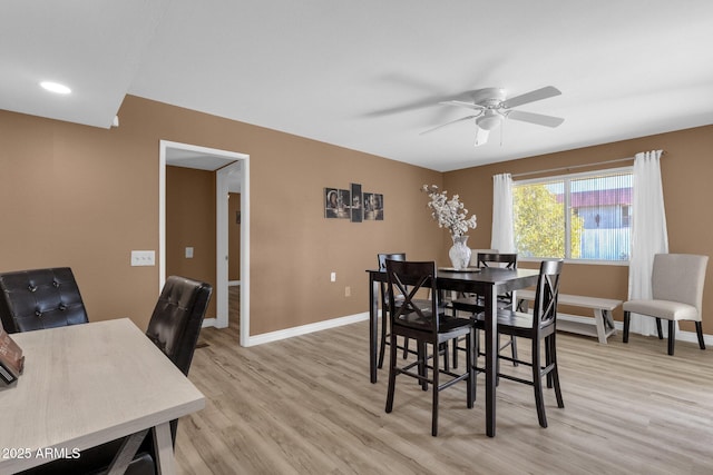 dining room featuring light hardwood / wood-style flooring and ceiling fan