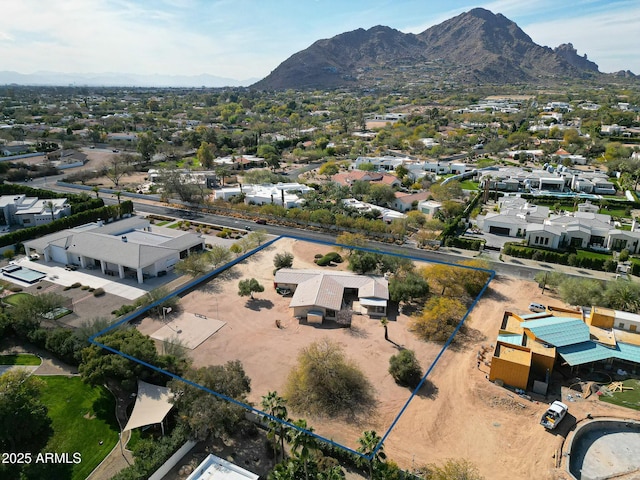 birds eye view of property with a mountain view