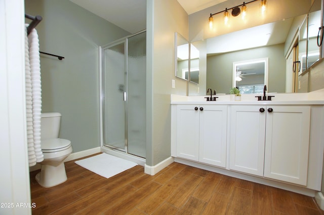 2150 W Alameda Rd Unit 1109, Phoenix, AZ 85085 - full bath with wood finished floors, a shower stall, toilet, and double vanity