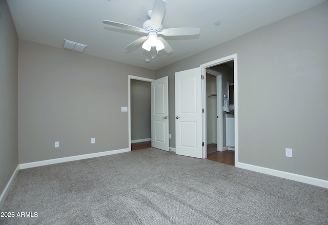 2150 W Alameda Rd Unit 1109, Phoenix, AZ 85085 - unfurnished bedroom featuring carpet, baseboards, and a ceiling fan