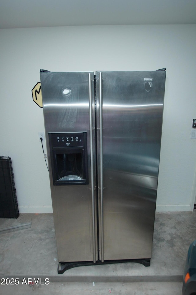 2150 W Alameda Rd Unit 1109, Phoenix, AZ 85085 - kitchen view of stainless steel refrigerator with ice dispenser, unfinished concrete flooring, and baseboards