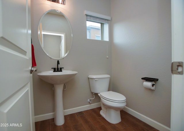 2150 W Alameda Rd Unit 1109, Phoenix, AZ 85085 - bathroom with toilet, wood finished floors, baseboards, and a sink