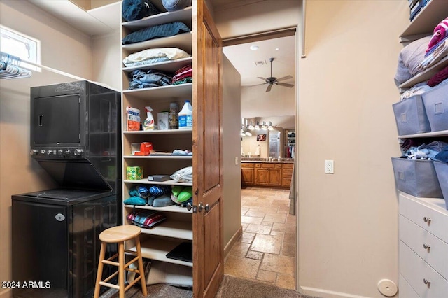 interior space featuring stacked washer and clothes dryer