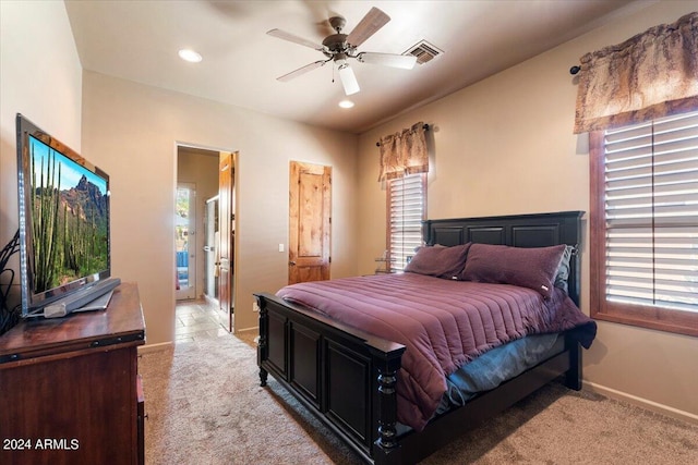 bedroom with recessed lighting, multiple windows, visible vents, and light colored carpet