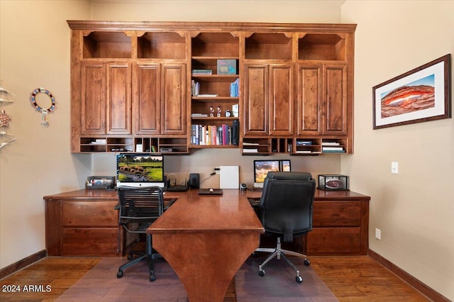 office with baseboards and wood finished floors