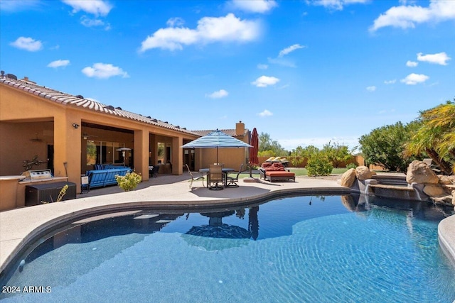 outdoor pool featuring a patio area, outdoor dining area, and an outdoor hangout area