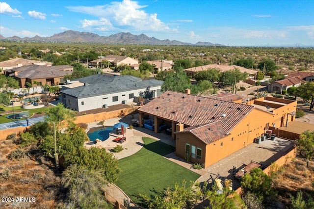 drone / aerial view featuring a residential view and a mountain view