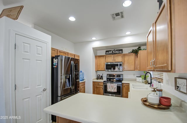 2325 S 88th Dr, Tolleson, AZ 85353 - kitchen with appliances with stainless steel finishes, kitchen peninsula, and sink