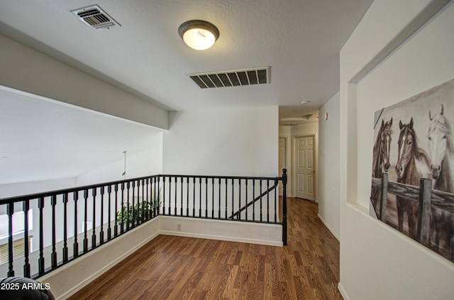 2325 S 88th Dr, Tolleson, AZ 85353 - corridor with dark hardwood / wood-style floors and a textured ceiling