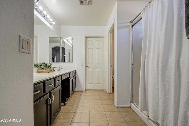 2325 S 88th Dr, Tolleson, AZ 85353 - bathroom featuring vanity, tile patterned floors, a textured ceiling, and a shower with curtain