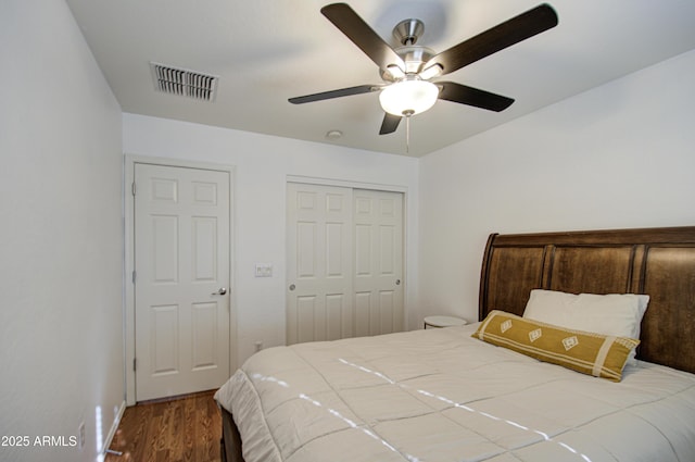 2325 S 88th Dr, Tolleson, AZ 85353 - bedroom with ceiling fan, wood-type flooring, and a closet