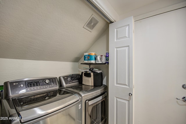 2325 S 88th Dr, Tolleson, AZ 85353 - laundry area featuring separate washer and dryer and a textured ceiling
