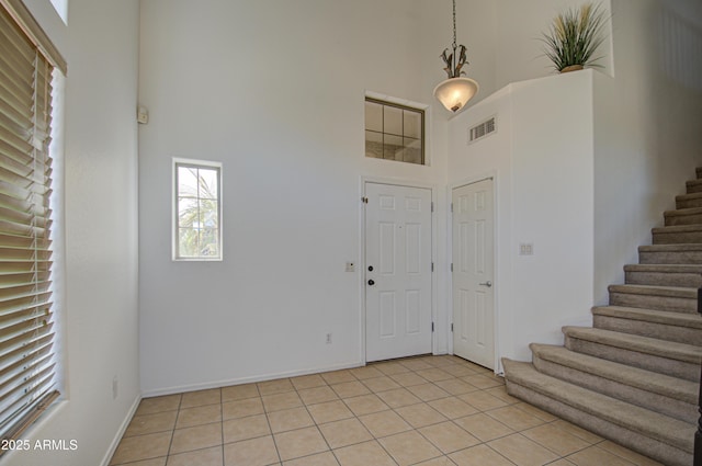 2325 S 88th Dr, Tolleson, AZ 85353 - foyer featuring light tile patterned floors and a high ceiling