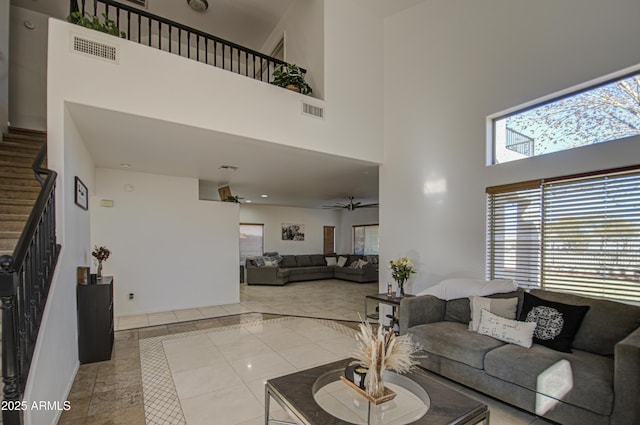 2325 S 88th Dr, Tolleson, AZ 85353 - living room with ceiling fan, a high ceiling, and light tile patterned floors
